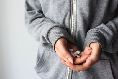 Midsection of woman holding hands