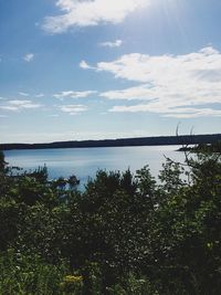 Scenic view of lake against cloudy sky