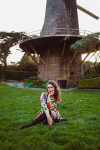 Portrait of smiling woman sitting outdoors