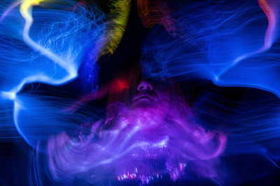 Fuzzy, beautiful and colorful light paintings, abstract light lines and blurred facial contours