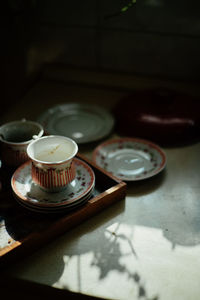 Close-up of old tea cup on table