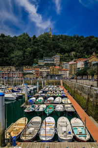 Boats moored at harbor