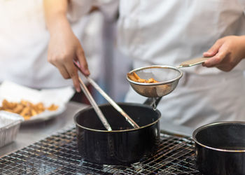 Midsection of man preparing food on table