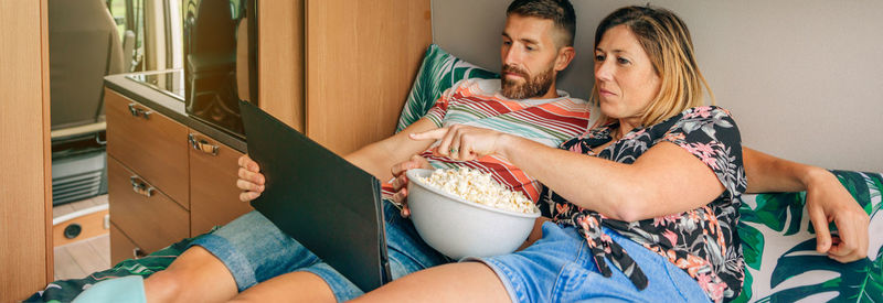 Couple watching movie at home