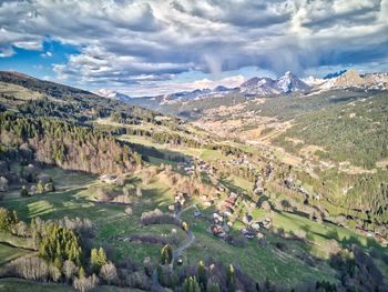 Aerial view of landscape against cloudy sky