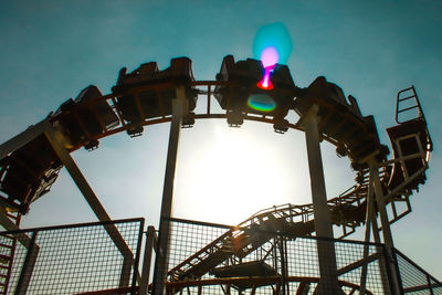 Low angle view of rollercoaster against sky