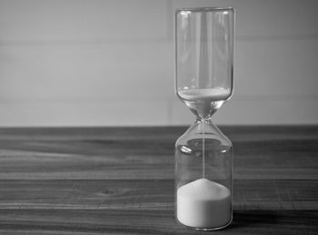 Close-up of clock on sand