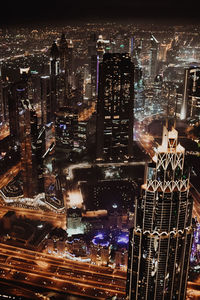 High angle view of illuminated city buildings at night