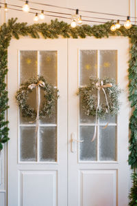 Traditional christmas wreath on an country house door.