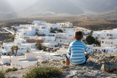 Little kid looking andalusian village in spain