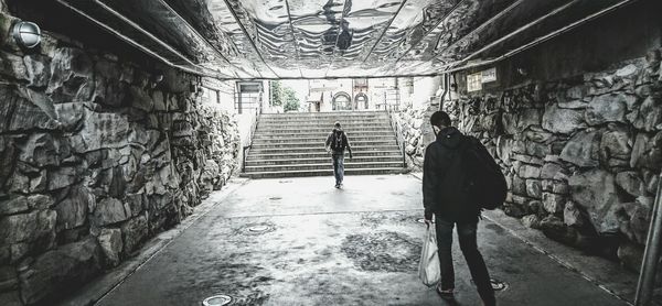 People walking in tunnel