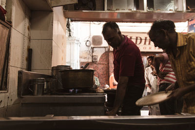 People working in kitchen