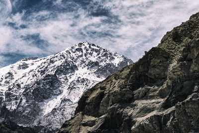 Scenic view of snow covered mountains against sky