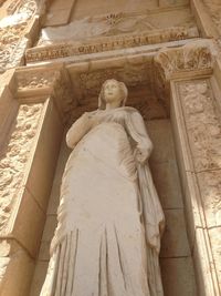 Low angle view of statue against temple