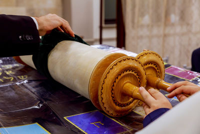 High angle view of old torah on table at synagogue