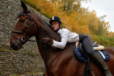 Portrait of woman riding horse