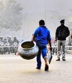 Rear view of men walking