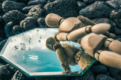 Close-up of hand holding rock