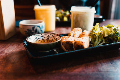 Close-up of food in serving tray on table