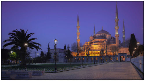 Panoramic view of illuminated temple against sky at night