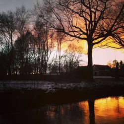 Scenic view of lake at sunset