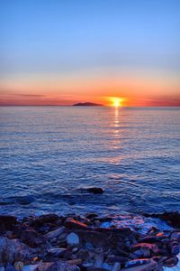 Scenic view of sea against sky during sunset