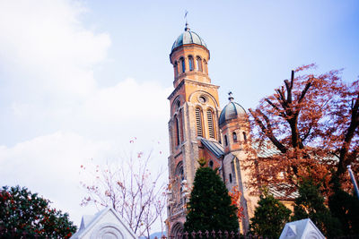 Low angle view of clock tower against sky