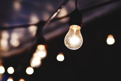 Low angle view of illuminated light bulb