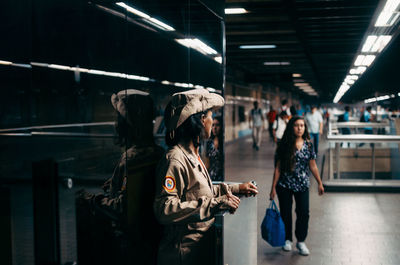 People standing on railroad station platform