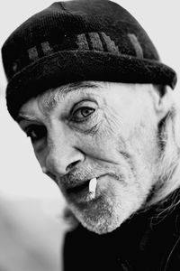 Close-up portrait of man wearing hat