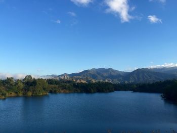 Scenic view of lake against blue sky