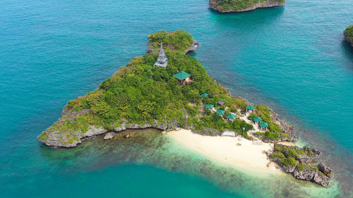 Tropical island with a sandy beach top view. lopez island, hundred islands national park