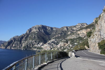 Scenic view of mountains against clear blue sky