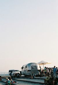 Cars on road against clear sky