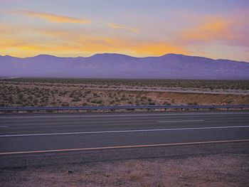 Scenic view of field against sky during sunset