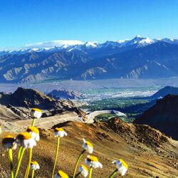 Scenic view of mountains against cloudy sky