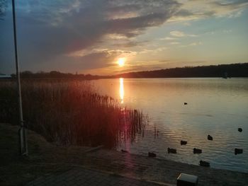 Scenic view of sunset over lake