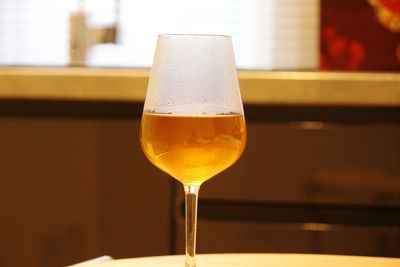 Close-up of beer glass on table