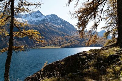 Scenic view of lake and mountains against sky