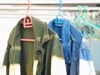 Close-up of clothes hanging on rack