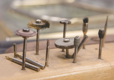 Close-up of nails on wood