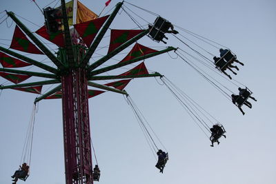 Low angle view of ferris wheel against sky