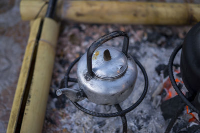 High angle view of fire on barbecue grill