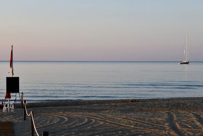 Scenic view of sea against clear sky during sunset