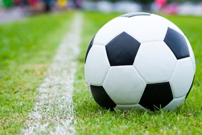 Close-up of soccer ball on field