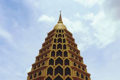 Low angle view of building against cloudy sky