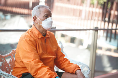 Side view of man working at construction site