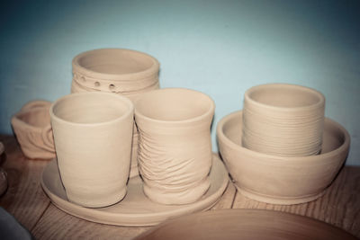 Close-up of objects on table against blue background