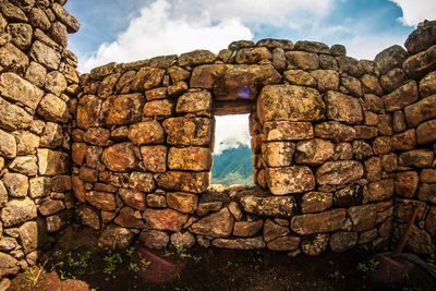 Stone wall against sky