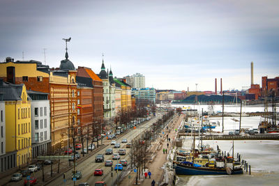 High angle view of city street and buildings against sky